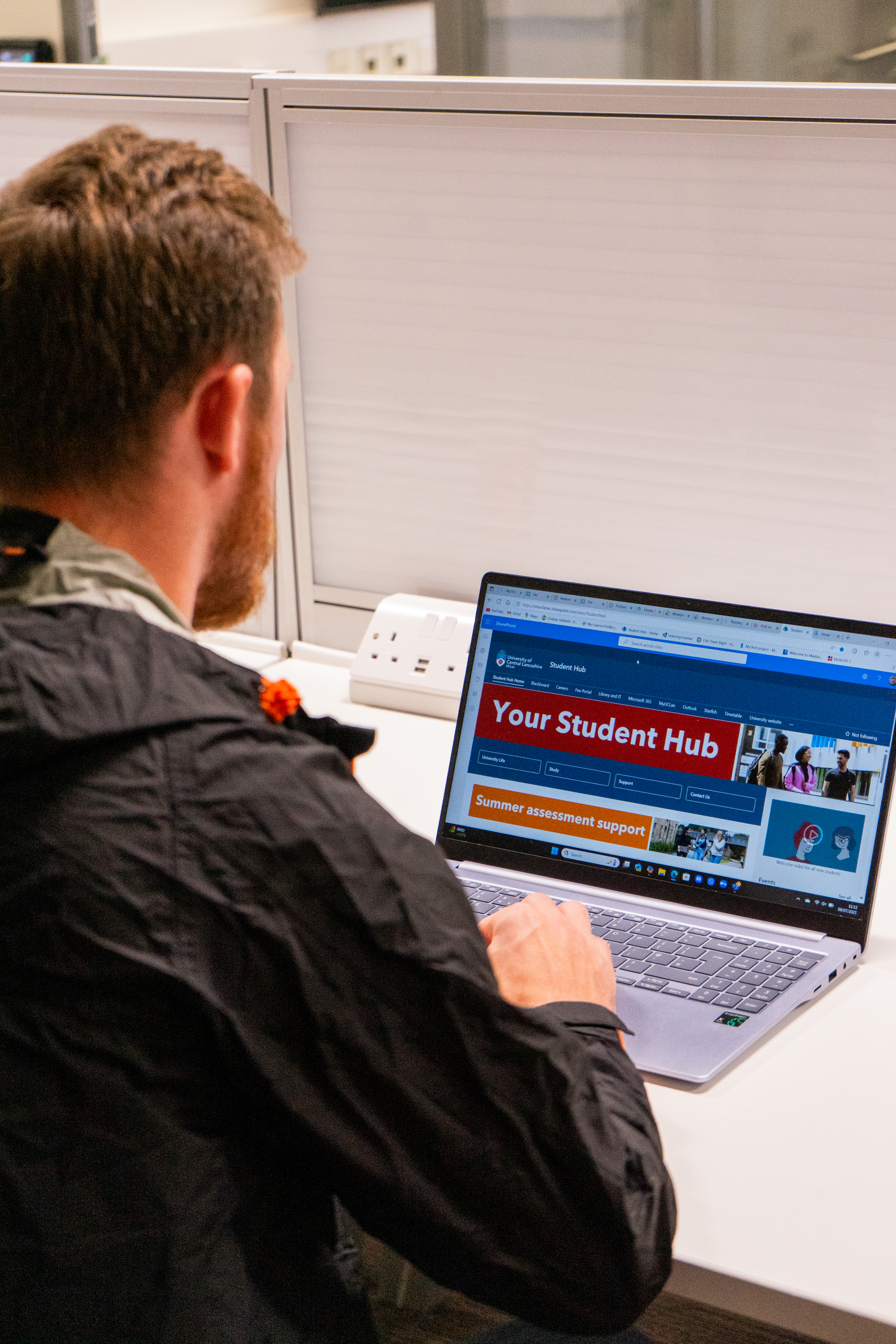 Student looking at Student hub